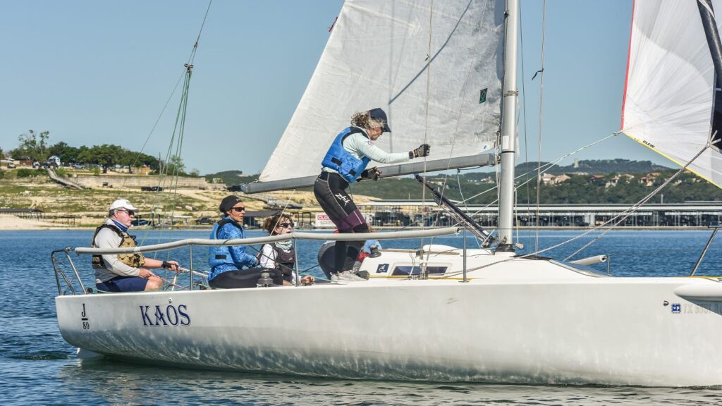 Balanced crew. Woman balancing on boat