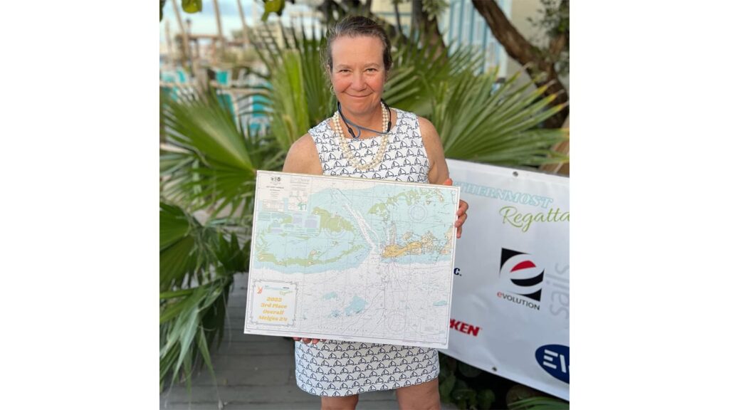 Laura Grondin after steering her J/70 Dark Energy with crew trimming sails on the racecourse.
