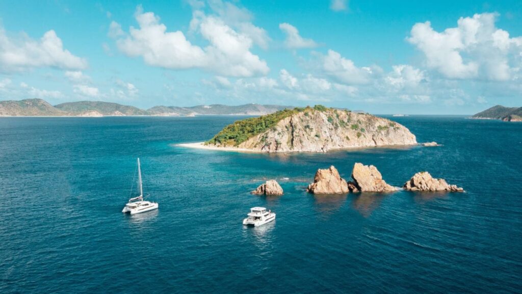 Two sailboats anchored near Indians in the BVI