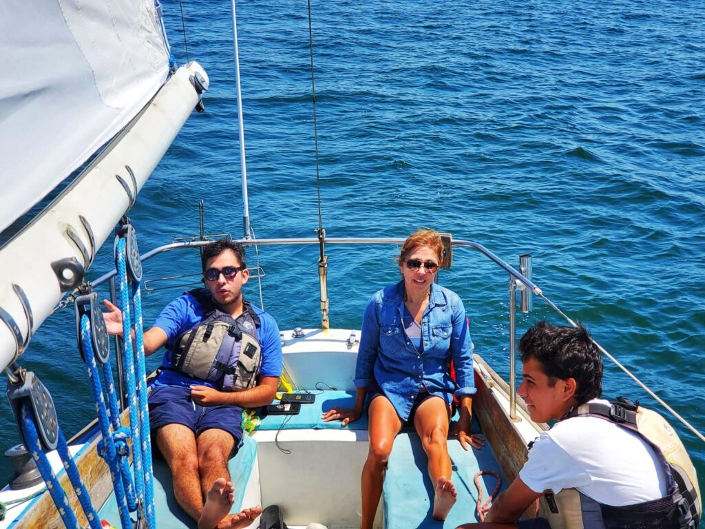 A family relaxes on a sailboat