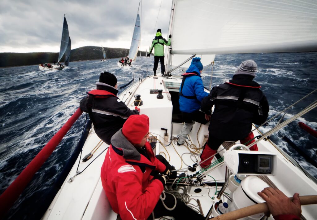 sailors racing in a storm