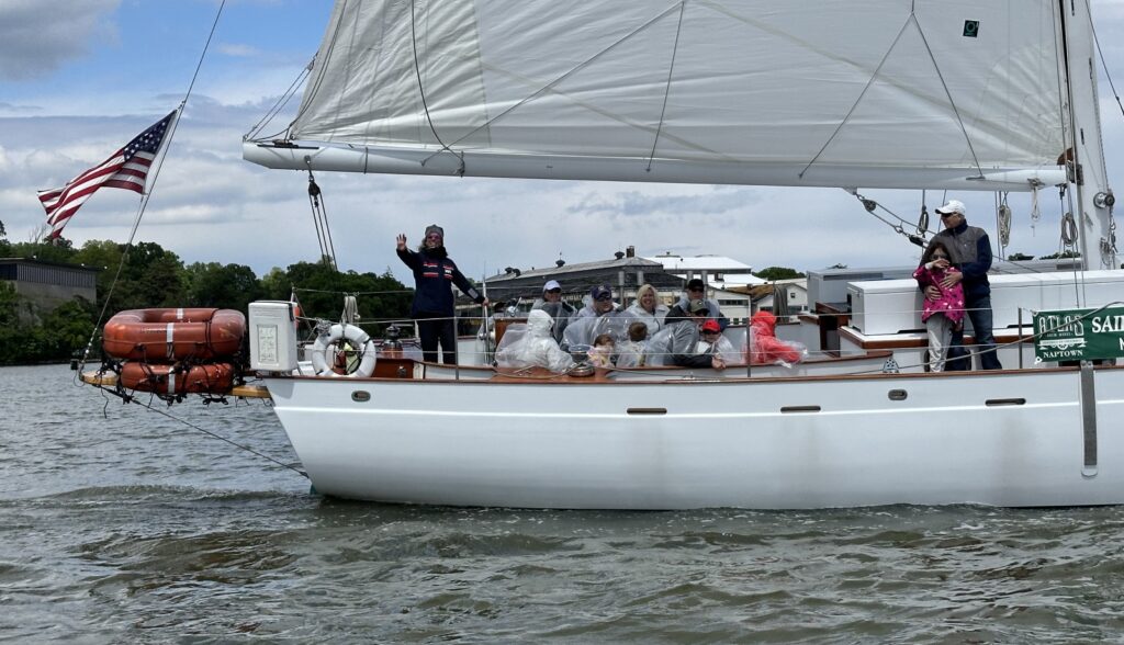 family aboard sailboat