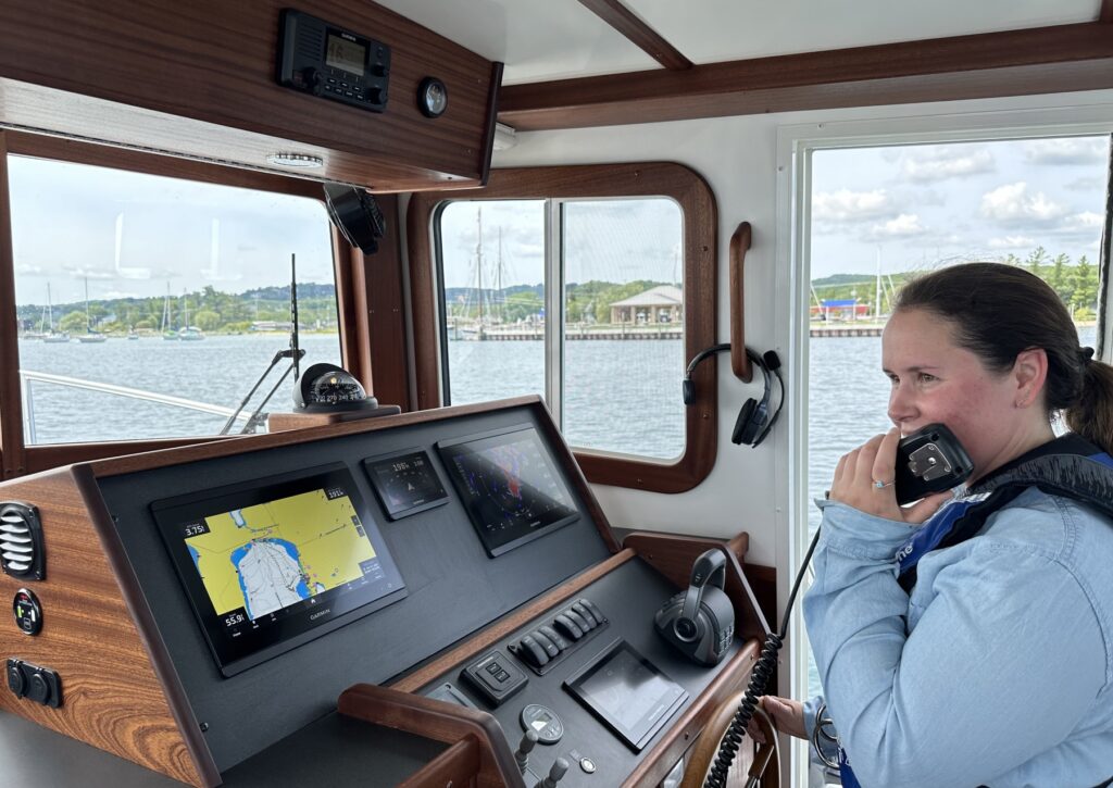 women at the helm with radio