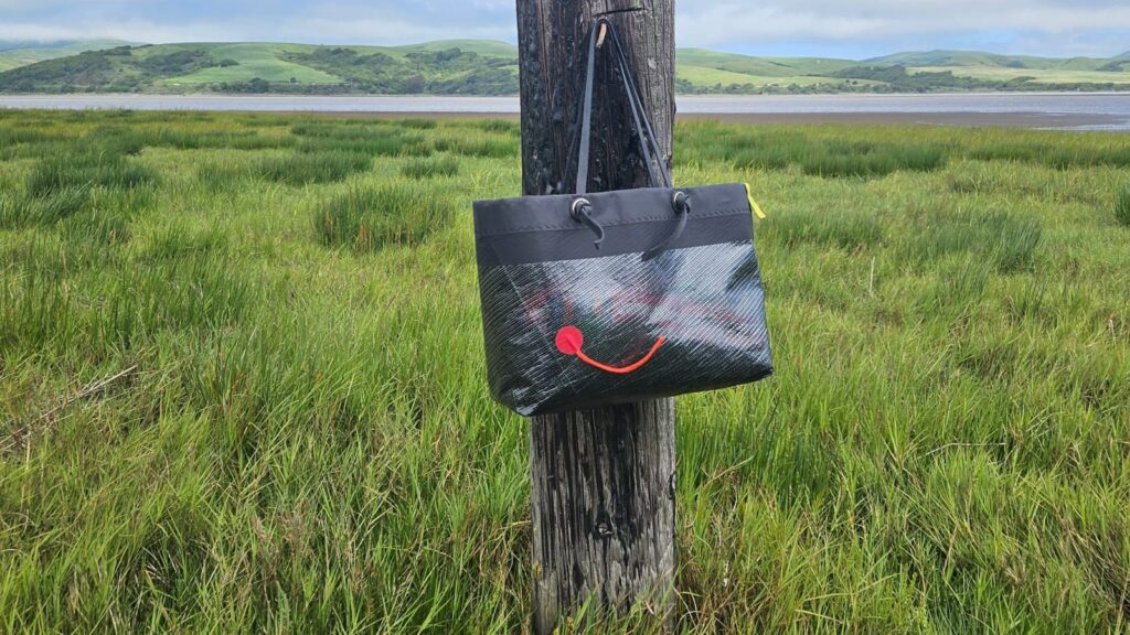 Landfall bag on a fence post in a field
