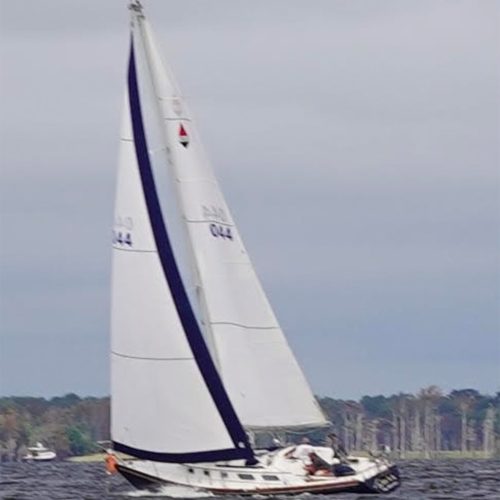 2 sailors on a boat. Go with the Flo Adventures